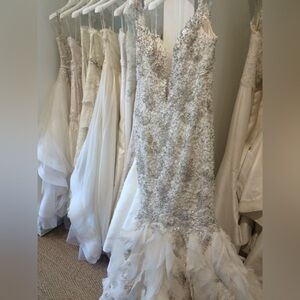 Color is Ivory, worn for two hours max. Dress washed, preserved & boxed since.